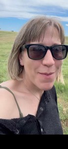 Rachel wearing Ray-Ban Meta smart glasses.